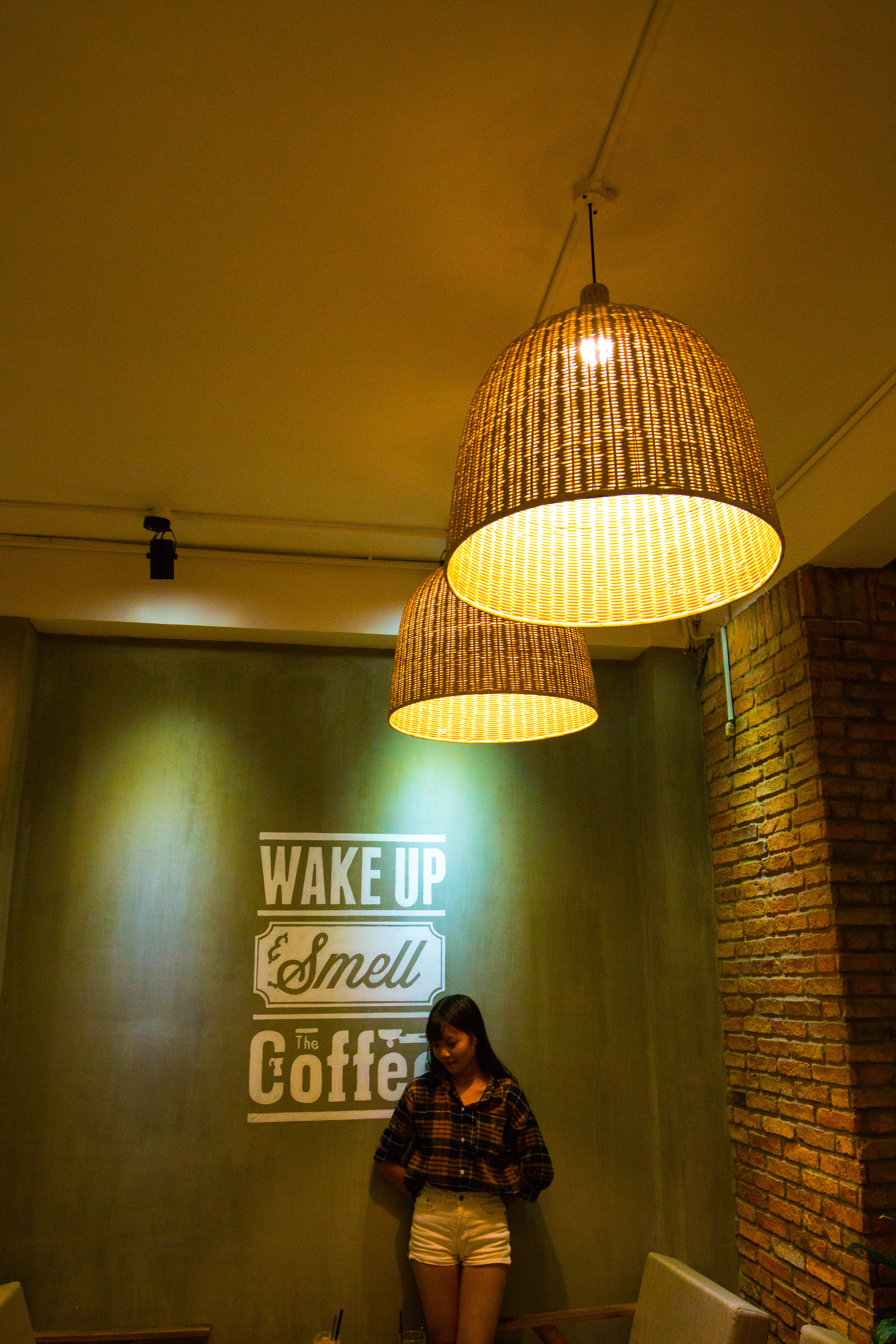 Photo by THIS IS  ZUN: https://www.pexels.com/photo/woman-standing-and-leaning-beside-wake-up-smell-the-coffee-text-wall-1187693/